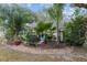 Landscaped backyard oasis with tropical plants at 8723 Sw 93Rd Ln # C, Ocala, FL 34481