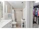 Bright bathroom featuring a sink vanity, shower with tile surround, and closet at 8723 Sw 93Rd Ln # C, Ocala, FL 34481