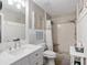 Updated bathroom featuring a sink vanity, shower with tile surround, and storage at 8723 Sw 93Rd Ln # C, Ocala, FL 34481