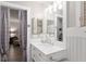 Updated bathroom with a sink vanity and unique curtain leading into another room at 8723 Sw 93Rd Ln # C, Ocala, FL 34481