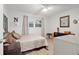 Cozy bedroom with a queen-size bed and window at 8723 Sw 93Rd Ln # C, Ocala, FL 34481