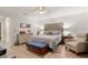 Bedroom featuring a cozy seating area, wooden floors, and a neutral color palette at 8723 Sw 93Rd Ln # C, Ocala, FL 34481