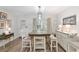 Stylish dining area with natural light, features a modern table with seating, and decorative lighting at 8723 Sw 93Rd Ln # C, Ocala, FL 34481