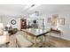 Spacious dining area with a rustic table and bench seating, open to the living room at 8723 Sw 93Rd Ln # C, Ocala, FL 34481