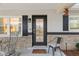 Charming front entrance featuring a black front door with glass panes, sidelight, and sidelite windows at 8723 Sw 93Rd Ln # C, Ocala, FL 34481
