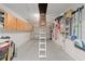 Garage with attic access, storage, and shelving at 8723 Sw 93Rd Ln # C, Ocala, FL 34481