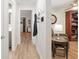 Bright hallway with hardwood floors, leading to other rooms at 8723 Sw 93Rd Ln # C, Ocala, FL 34481