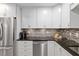 Modern kitchen with stainless steel appliances and granite countertops at 8723 Sw 93Rd Ln # C, Ocala, FL 34481