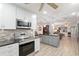 Modern kitchen with stainless steel appliances and an island at 8723 Sw 93Rd Ln # C, Ocala, FL 34481