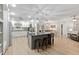 Bright kitchen with gray island, stainless steel appliances, modern cabinetry, and hardwood flooring at 8723 Sw 93Rd Ln # C, Ocala, FL 34481