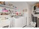 Bright laundry room with washer, dryer, and shelving at 8723 Sw 93Rd Ln # C, Ocala, FL 34481