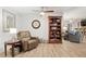 Relaxing living room with a comfortable recliner and built-in bookcase at 8723 Sw 93Rd Ln # C, Ocala, FL 34481