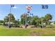 Patriotic memorial with flags and manicured landscaping provides a serene space for reflection at 8723 Sw 93Rd Ln # C, Ocala, FL 34481