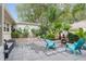 Private backyard patio with mature landscaping, outdoor seating, brick planter and a fire pit to enjoy the Florida lifestyle at 8723 Sw 93Rd Ln # C, Ocala, FL 34481
