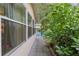 Side yard with stone path and tropical plants at 8723 Sw 93Rd Ln # C, Ocala, FL 34481