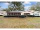Ranch home with screened patio and well manicured lawn at 8851 Sw 92Nd Pl # E, Ocala, FL 34481