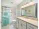 Clean bathroom with a tub shower, vanity and granite countertop at 8851 Sw 92Nd Pl # E, Ocala, FL 34481