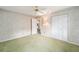 Bedroom with double door closet and carpet flooring at 8851 Sw 92Nd Pl # E, Ocala, FL 34481