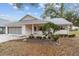 Cute brick ranch home with mature landscaping and a porch at 8851 Sw 92Nd Pl # E, Ocala, FL 34481