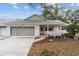 Brick ranch home with screened porch and 2-car garage at 8851 Sw 92Nd Pl # E, Ocala, FL 34481