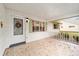 Covered front porch with white brick exterior and wreath at 8851 Sw 92Nd Pl # E, Ocala, FL 34481