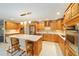 Spacious kitchen featuring an island, stainless steel appliances, and ample cabinetry at 8851 Sw 92Nd Pl # E, Ocala, FL 34481