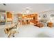 Open floor plan with a kitchen island, breakfast nook, and Gathering room at 8851 Sw 92Nd Pl # E, Ocala, FL 34481