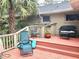 Multi-level deck with seating and surrounding greenery at 1040 Se 9Th Ave, Ocala, FL 34471