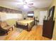 Spacious bedroom with hardwood floors, a ceiling fan, and lots of light at 1040 Se 9Th Ave, Ocala, FL 34471