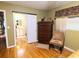 Bedroom with hardwood floors, dresser, and access to bathroom at 1040 Se 9Th Ave, Ocala, FL 34471