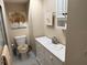 Bathroom with toilet, vanity, and linen cabinet at 11120 Sw 71St Terrace Rd, Ocala, FL 34476