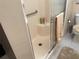 Walk-in shower with grab bar and glass enclosure at 11120 Sw 71St Terrace Rd, Ocala, FL 34476