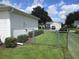 Fenced backyard with grassy area and access gate at 11388 Sw 138Th Ln, Dunnellon, FL 34432