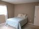 Spacious bedroom with a queen bed at 11388 Sw 138Th Ln, Dunnellon, FL 34432