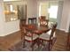 Charming dining area with round table and four chairs, kitchen view at 11388 Sw 138Th Ln, Dunnellon, FL 34432