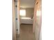 Bright hallway with doors to bedrooms and bathroom at 11388 Sw 138Th Ln, Dunnellon, FL 34432