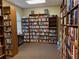 Well-lit library features expansive bookshelves filled with a wide array of books at 11388 Sw 138Th Ln, Dunnellon, FL 34432