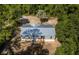 Aerial view showing a gray manufactured home with a metal roof at 1143 Se 159Th Ct, Silver Springs, FL 34488