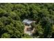 Aerial view of mobile home nestled in wooded area at 1143 Se 159Th Ct, Silver Springs, FL 34488