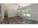 Living room features wood-look floors and lots of natural light at 1143 Se 159Th Ct, Silver Springs, FL 34488