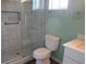 Modern bathroom featuring a walk-in shower with marble tile and glass enclosure at 11500 Sw 136Th Pl, Dunnellon, FL 34432