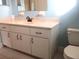 Bathroom with vanity, sink, and toilet at 11500 Sw 136Th Pl, Dunnellon, FL 34432