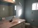 Bright bathroom featuring a vanity with a sink, toilet and shower at 11500 Sw 136Th Pl, Dunnellon, FL 34432