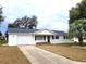 Single story home with attached garage and well maintained lawn at 11500 Sw 136Th Pl, Dunnellon, FL 34432