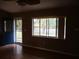 Living room featuring hardwood floors and a view of the front yard at 11500 Sw 136Th Pl, Dunnellon, FL 34432