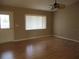 Spacious living room with hardwood floors and ample natural light at 11500 Sw 136Th Pl, Dunnellon, FL 34432