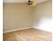 Living room with light walls, laminate floors, and ceiling fan at 11500 Sw 136Th Pl, Dunnellon, FL 34432