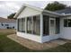 Exterior view of a sunroom addition with a view of the yard at 11500 Sw 136Th Pl, Dunnellon, FL 34432