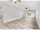 Spacious living area featuring wood-look floors and abundant natural light at 11759 Bostick St, Dunnellon, FL 34432