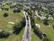 Aerial view of community entrance and surrounding homes at 13779 Sw 111Th Ave, Dunnellon, FL 34432